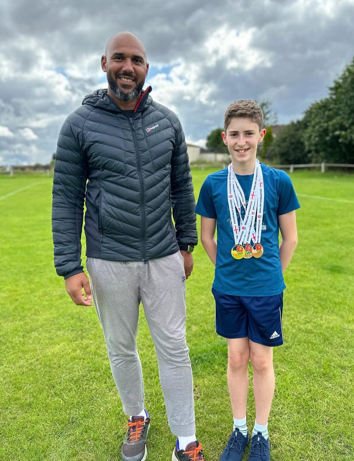 Medal-winning athlete with Tim Abeyie at Speed For Sport
