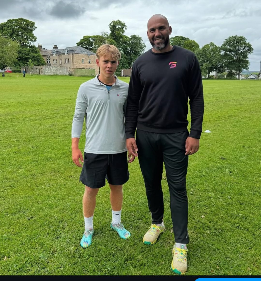 Tim Abeyie with an athlete