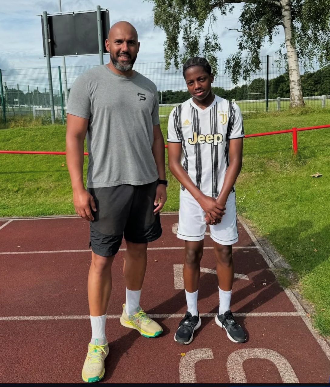 Tim Abeyie working with a young Speed For Sport athlete on the track