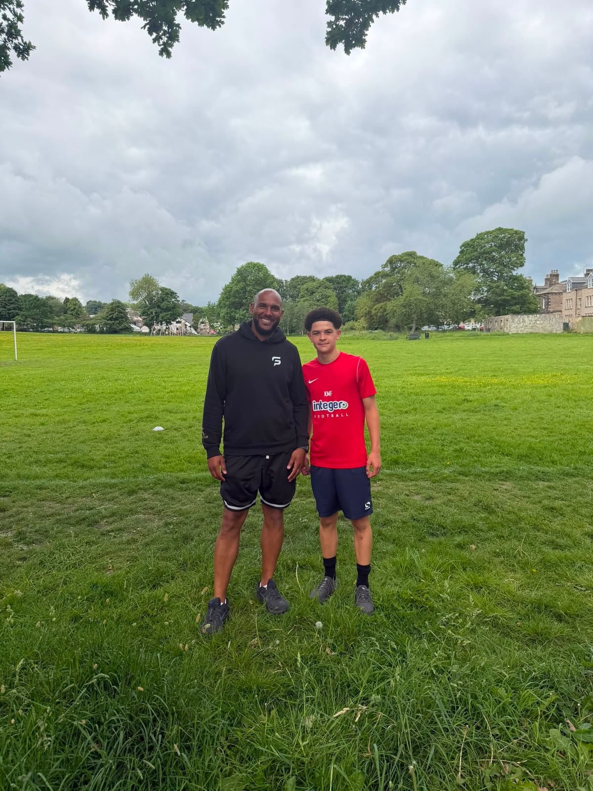 Tim Abeyie with a young footballer after an elite coaching session