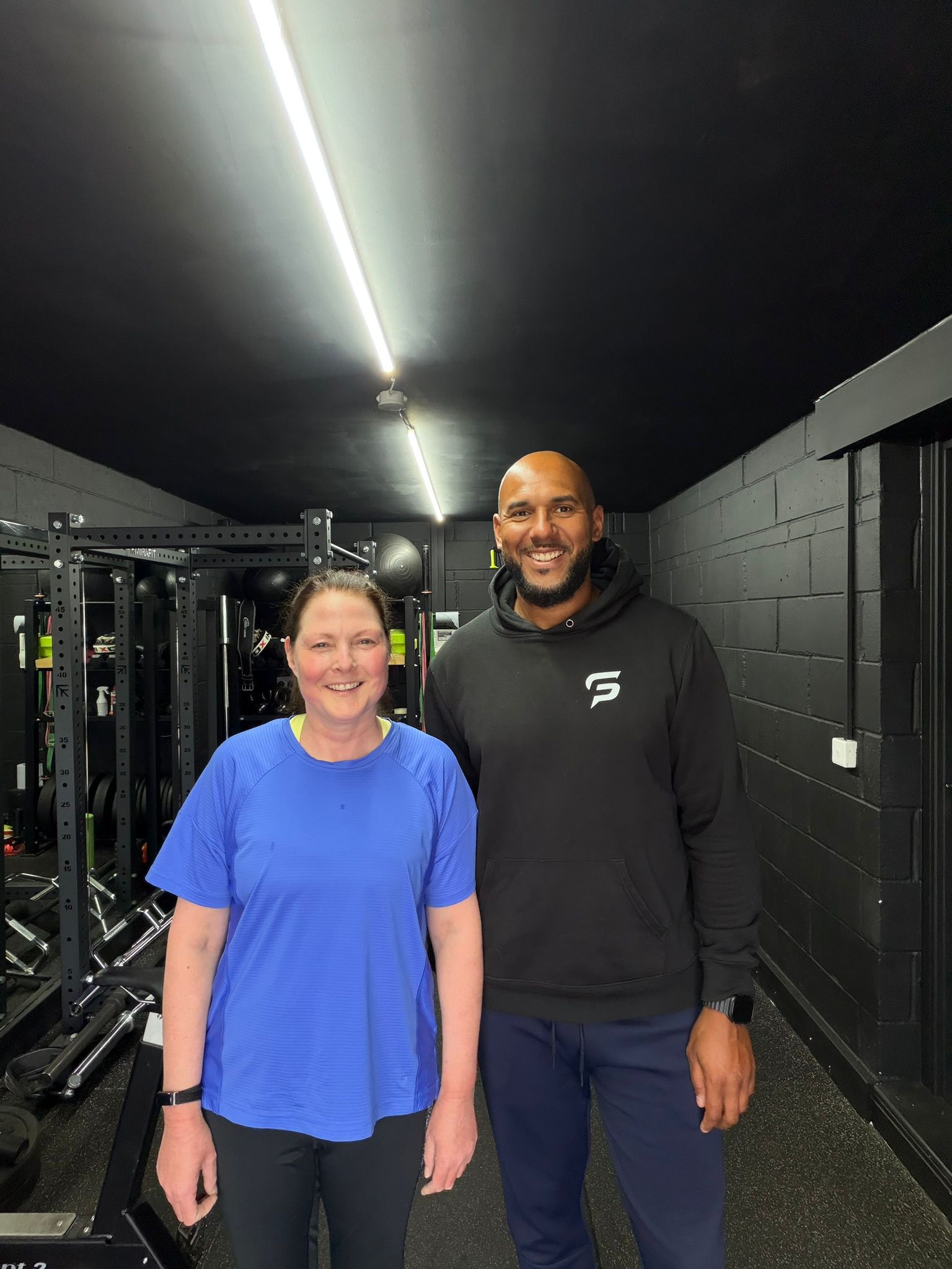 Tim Abeyie with a client in the Speed For Sport gym, Leeds